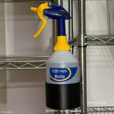Spray bottle in a black holder attached to a grooved wire shelving pole.